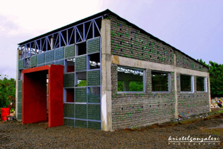 Illustration for article titled These Ingenious Buildings Were All Built Using Recycled Materials